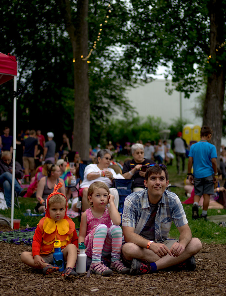 Callum Duggan, Neve Duggan and Lawrence Duggan listen to a musical performance
